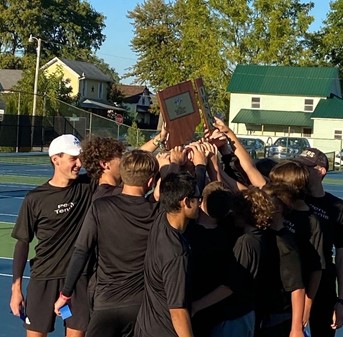 Image of the high school tennis team holding a trophy