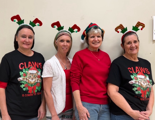 PJSHS cafeteria workers posing in their Christmas outfits