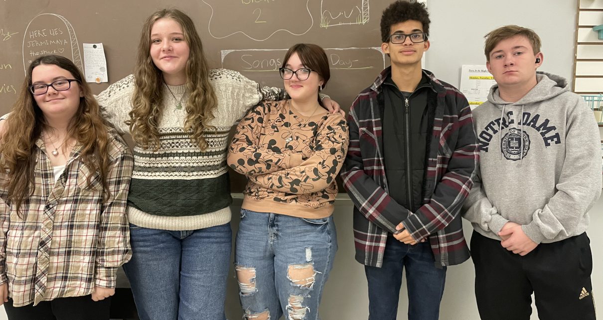 A photo of the five students in Journalism class