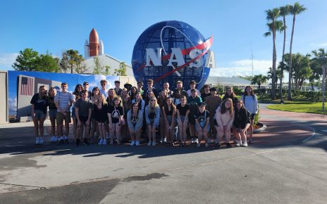 Group photo of the senior trip in front of the Universal Studio's globe