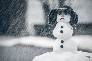 sad snowman in the snow
